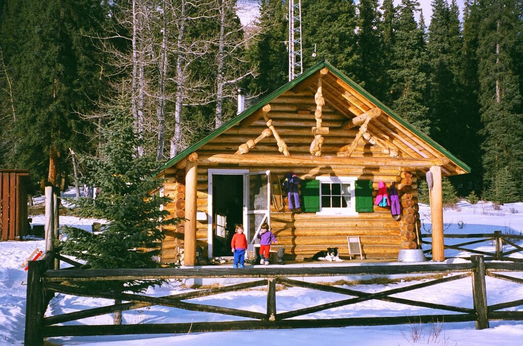Jen, Erin and Max on porch for Brazeau cabin March 2000